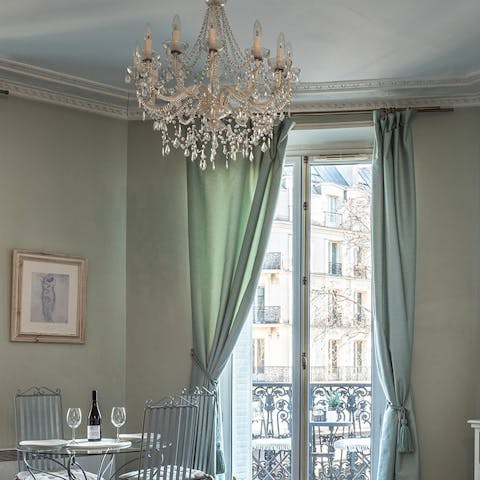 Admire your home's stunning finishing touches including the living room's stunning chandelier