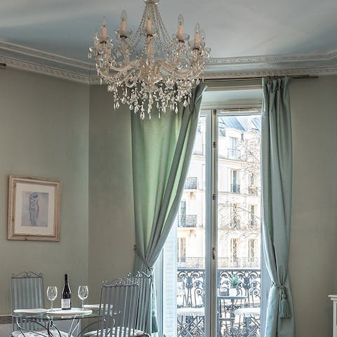 Admire your home's stunning finishing touches including the living room's stunning chandelier
