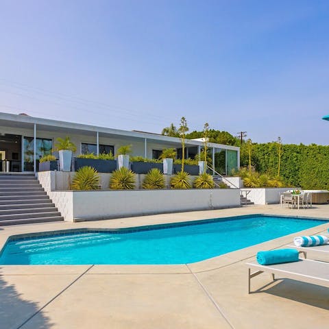 Take a dip in the pool, come day or night after a day out exploring Downtown – a seven-minute drive away