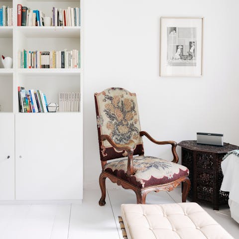 Admire the mix of modern design and antique pieces in the bright living room