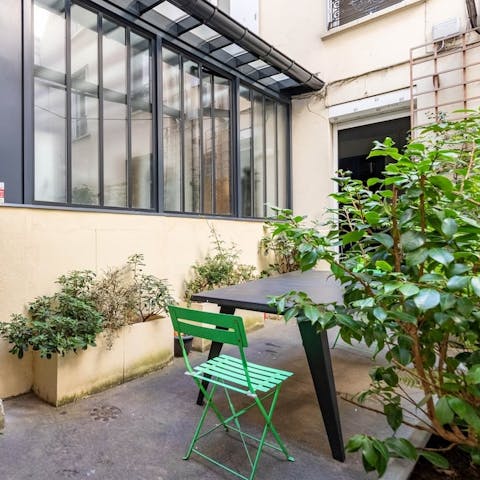 Relax in the courtyard after a busy day in the City of Light