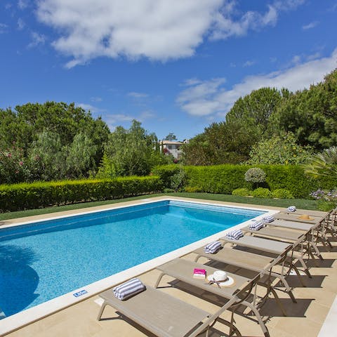 Lounge by the large private swimming pool