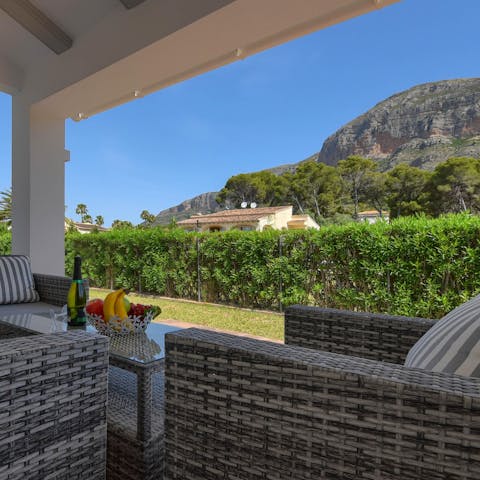 Gaze out at marvellous mountain views from the covered terrace