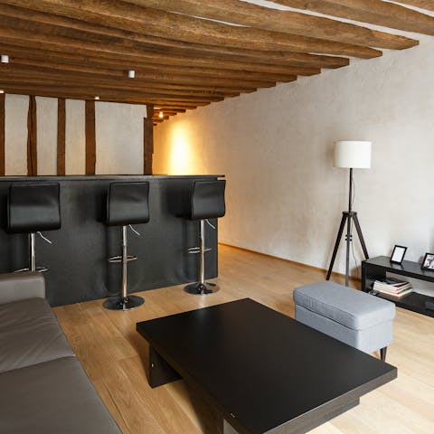 Take in the home's original character, with its wooden rafters and plaster walls