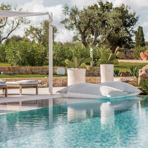 Embrace peace and relaxation while lounging by the pool