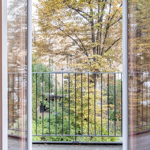 Take in the views over the neighbourhood from the balcony