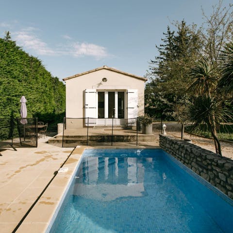 Enjoy a glass of Champagne by the private pool