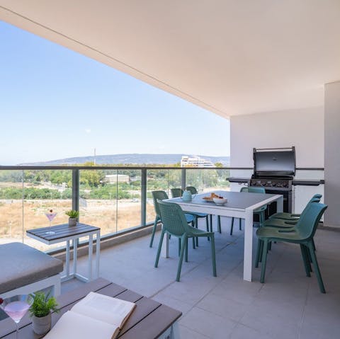 Dine alfresco on the balcony with a barbequed lunch