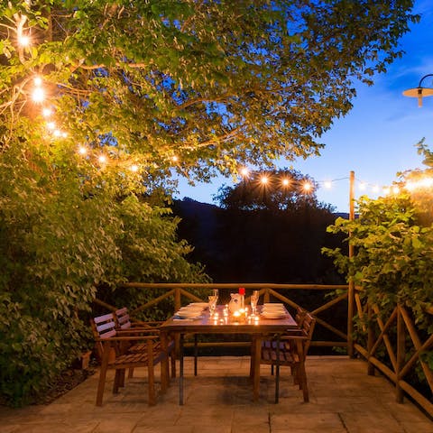 Enjoy balmy evenings dining alfresco under festoon lights