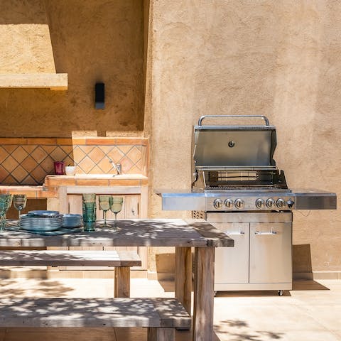 Fire up the barbecue and grill some locally sourced fresh fish at the outdoor kitchen