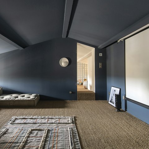 Cosy up for a movie night in the loft's cinema room