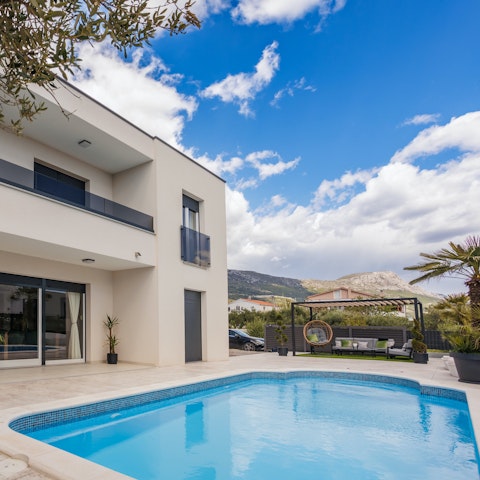 Take in the mountain view from the private heated pool