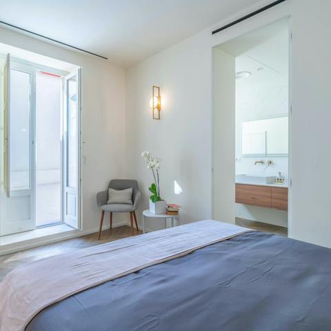 Wake up to sunshine streaming through the balcony doors