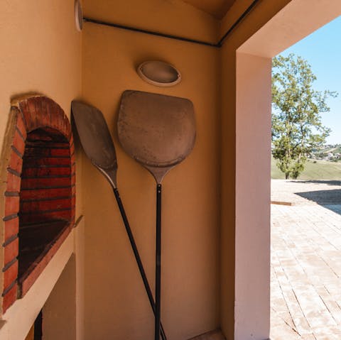 Try your hand at becoming a culinary maestro with the outdoor pizza oven