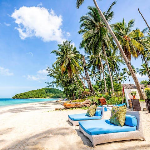 Relax on the day beds while taking in views over the Gulf of Siam