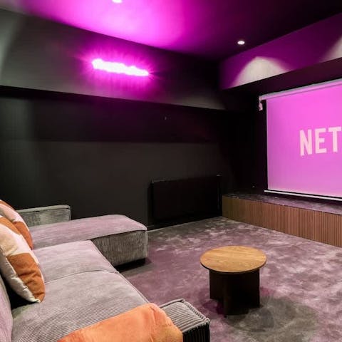 Gather for a cosy movie night in the home cinema room