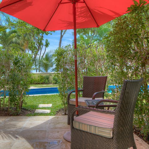 Share a bottle of wine and some nibbles on the private patio which leads to the communal pool