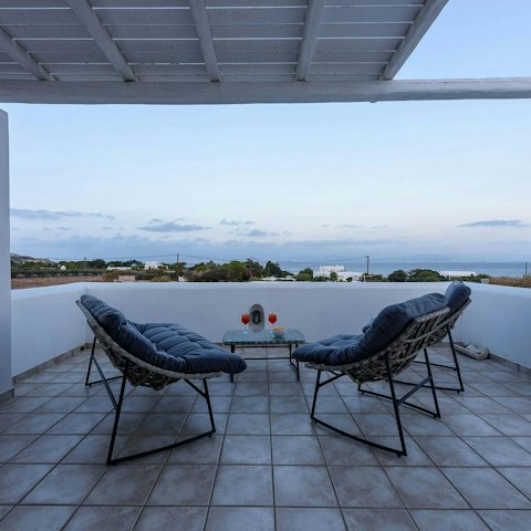 Watch the sunset with a glass of Paros wine in hand