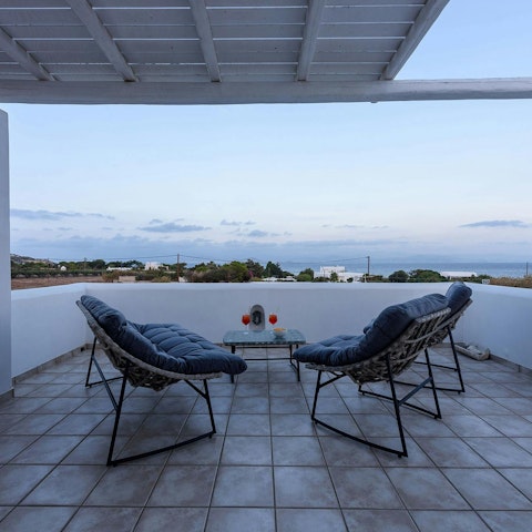 Watch the sunset with a glass of Paros wine in hand