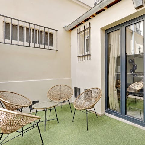 Share a bottle of wine on the small terrace