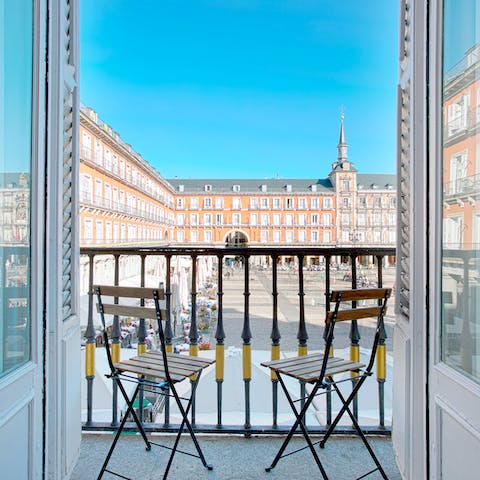 Sip a sundowner on the private balcony while taking in privileged views of the plaza