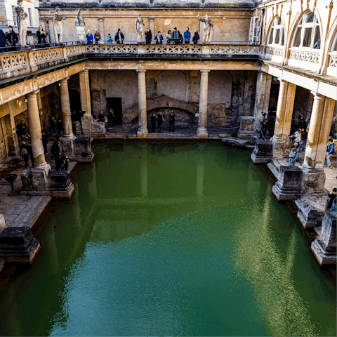 Visit the Roman Baths, just a short walk away