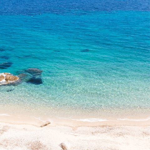 Head to Ftelia Beach for a day of sun, sand, and sea, just a five-minute drive from home