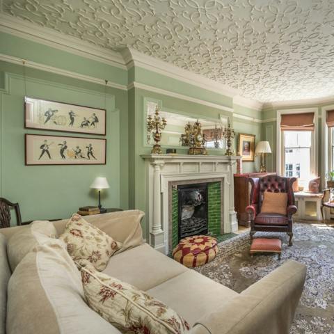 Relax on the sofa with a cup of tea and a plate of biscuits