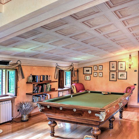 Head up to the mezzanine for a game of billiards