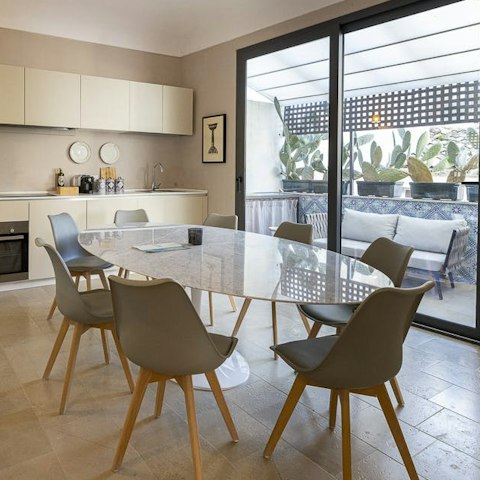 Enjoy a meal and plan trips around Sicily in the dining area