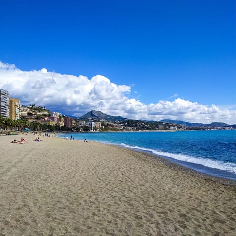 Spend leisurely days at Malagueta Beach, a twelve-minute walk away