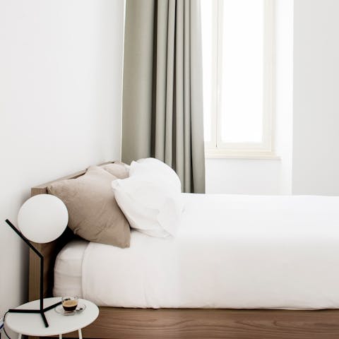 Enjoy a blissful sleep in the fresh and modern bedroom