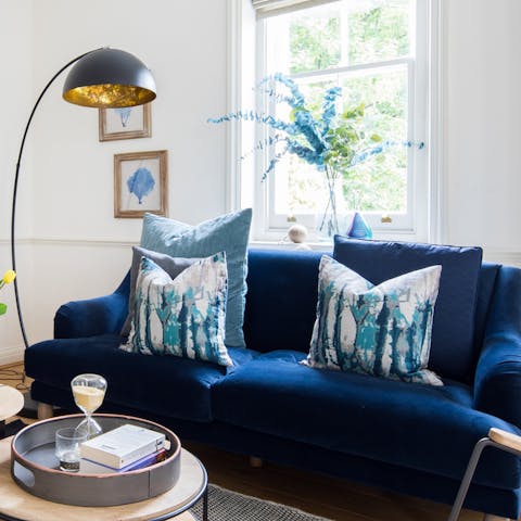 The bright blue velvet sofa