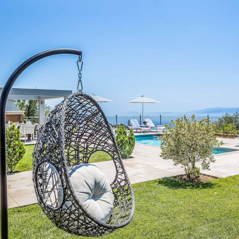 Grab a book and rest for a while in the swinging egg chair