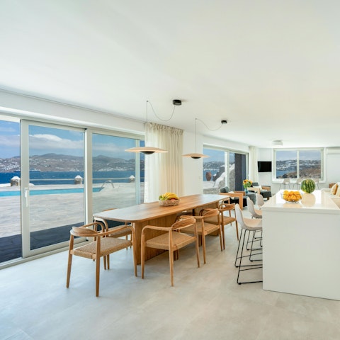 Enjoy pottering around the bright living area while admiring views of the sea