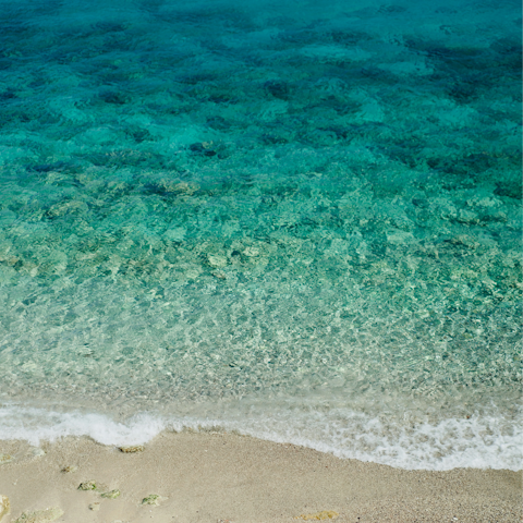Go for a swim in the clear waters at Korfos Beach, a short drive away