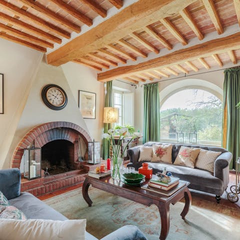 Relax in the opulent villa beside the fireplace