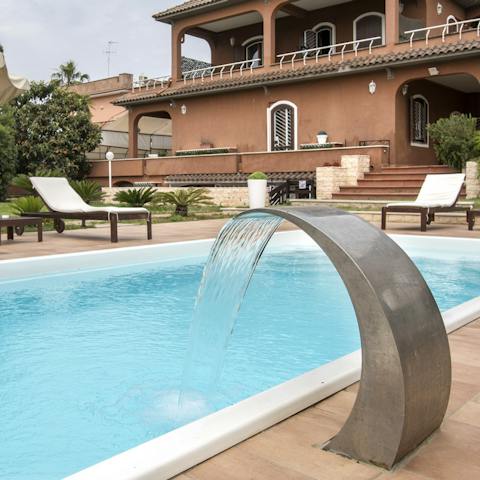 Take a dip in this gorgeous, private pool whenever you need to cool down