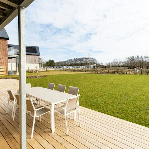 Enjoy an alfresco meal on the patio with a wide-open garden and the countryside as your backdrop