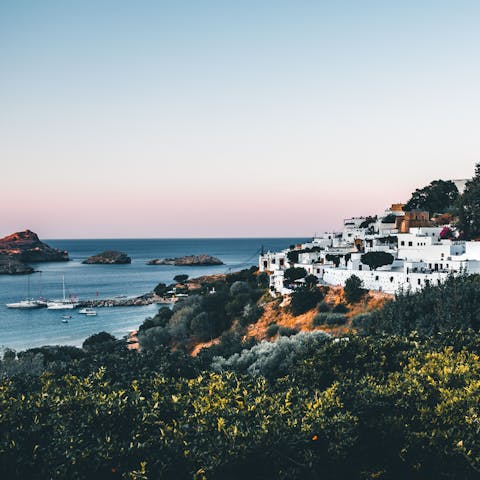 Explore the historic streets of Lindos – a short drive away