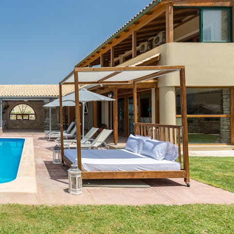 Relax on your sun bed as you listen to the soothing sounds of the ocean