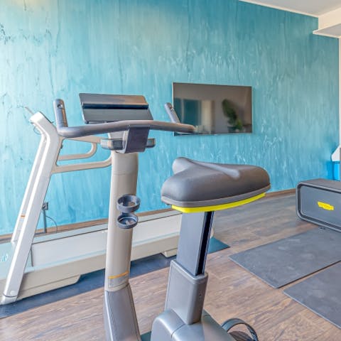 Stay on top of your fitness goals with a workout in the communal gym