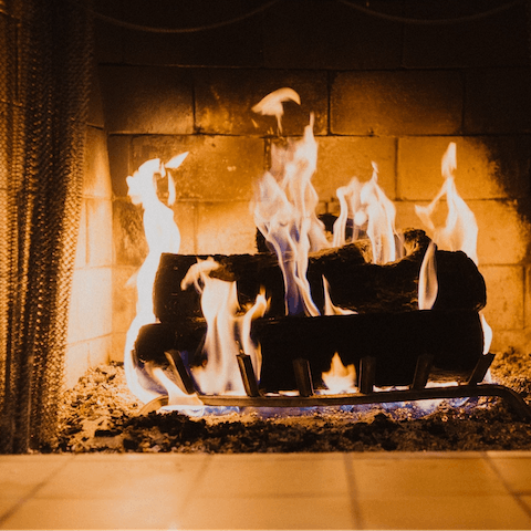 Warm yourself around one of the fireplaces, kept going by the butler