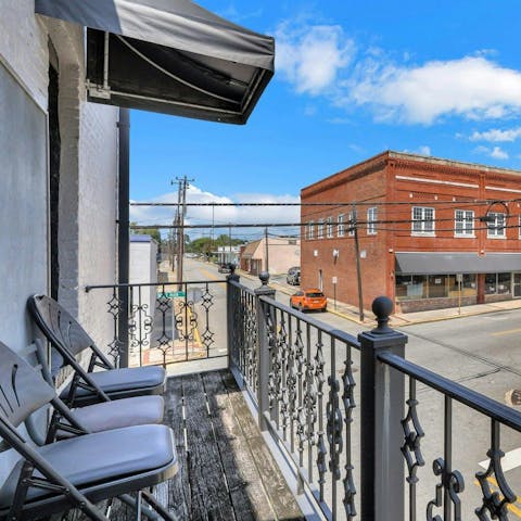 Relax on the balcony with a locally brewed beer