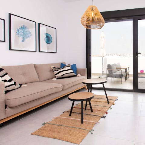Kick back and unwind in the bright living room with your favourite Netflix show