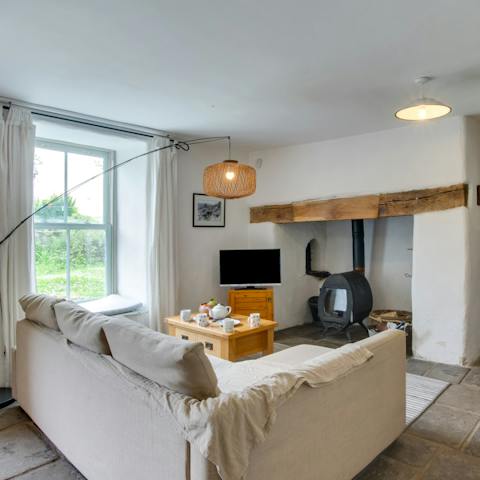 Enjoy a warm welcome from the cosy charm of the living room