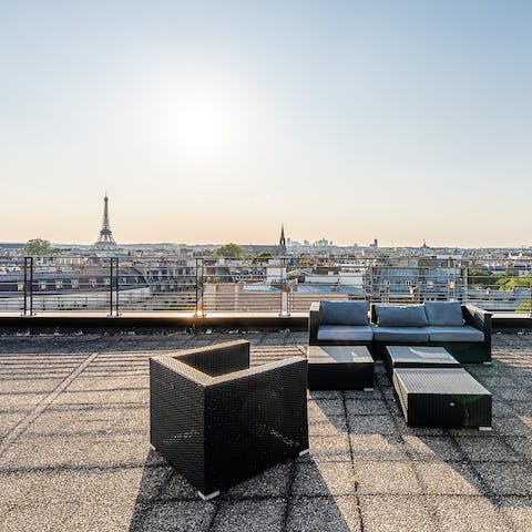 Admire the Eiffel Tower vistas with a glass of wine from the welcome hamper