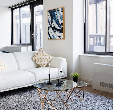 Relax in the bright living room with abstract art