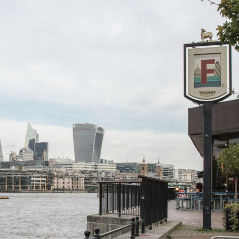 Stroll along the Thames and dine riverside