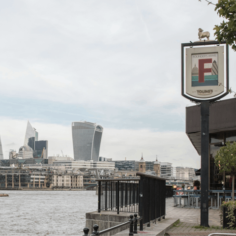 Stroll along the Thames and dine riverside